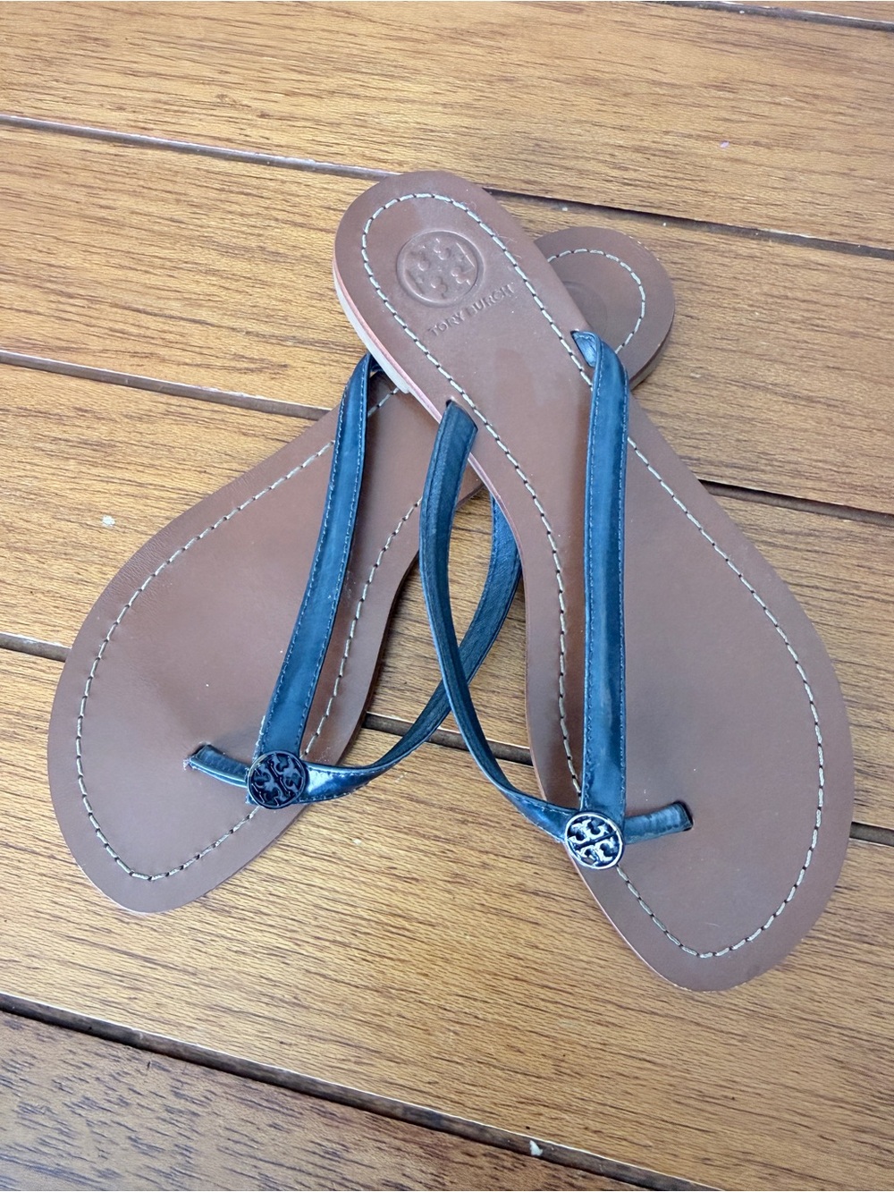 Tory Burch Brown Leather Flip Flops with Black Straps and Logo Medallions